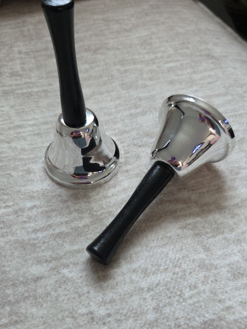 Set of Two Silver Handheld Bells with Black Handles